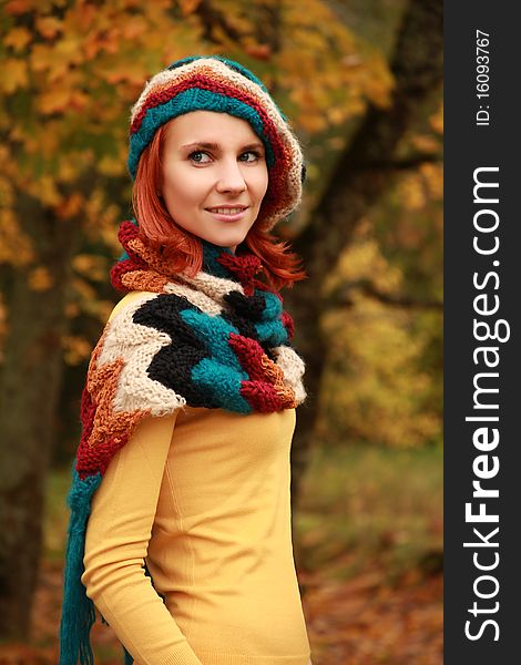 Young girl walking in autumn park. Young girl walking in autumn park