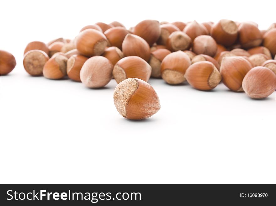 Brown haselnuts isolated on white