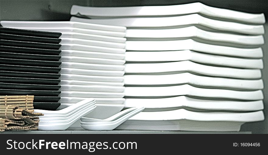 Stack of white and black square plates