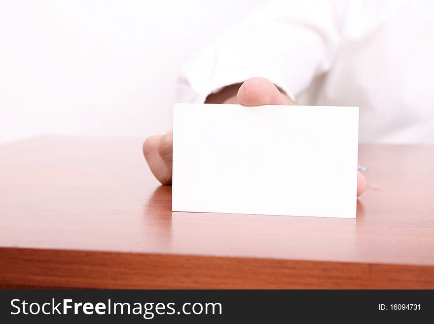 Businessman showing blank business card on white background