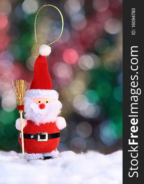 Decorative doll of a Santa Claus on festive background