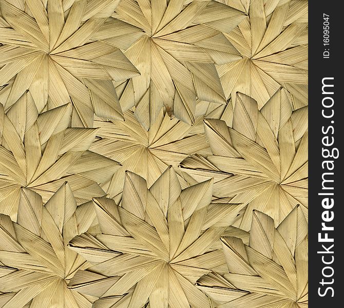 Dried leaves woven together in design. Dried leaves woven together in design