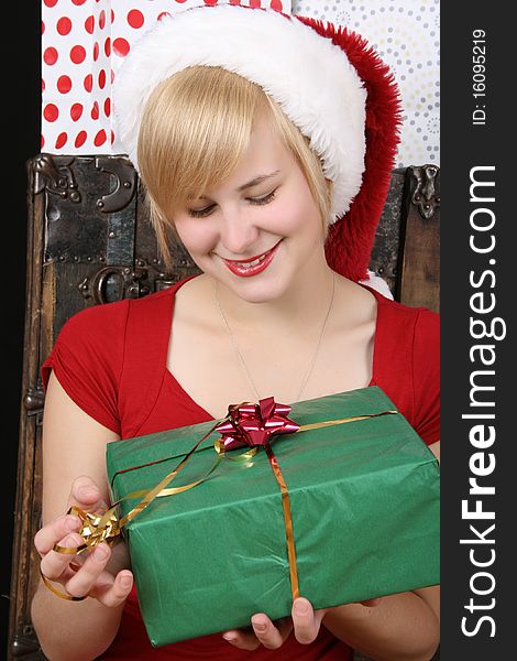 Beautiful blond female holding a christmas present. Beautiful blond female holding a christmas present