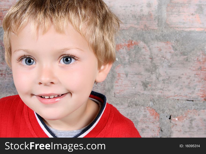 Cute blond boy with big blue eyes