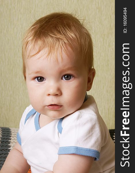 Portrait of little cute baby-boy with grey eyes