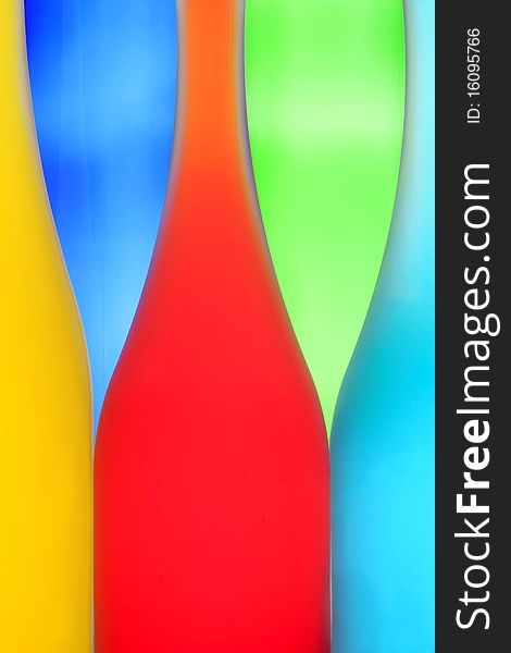 Three color bottles on a multi-colored background