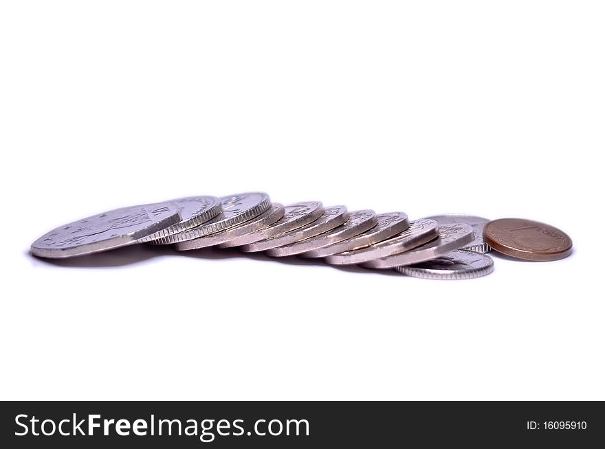 Several british coins and one euro isolated on white background. Several british coins and one euro isolated on white background