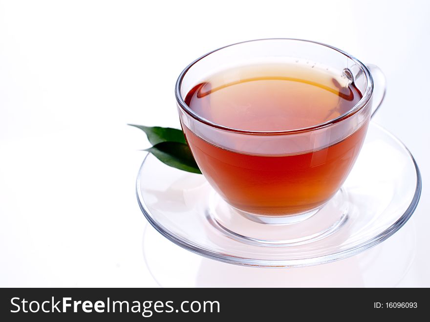 A cup of black tea on a white background