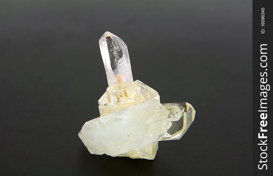 Large quartz crystal on a gray background