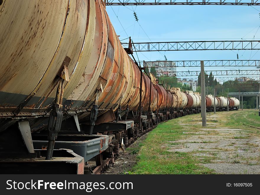 The train transports old tanks with oil and fuel