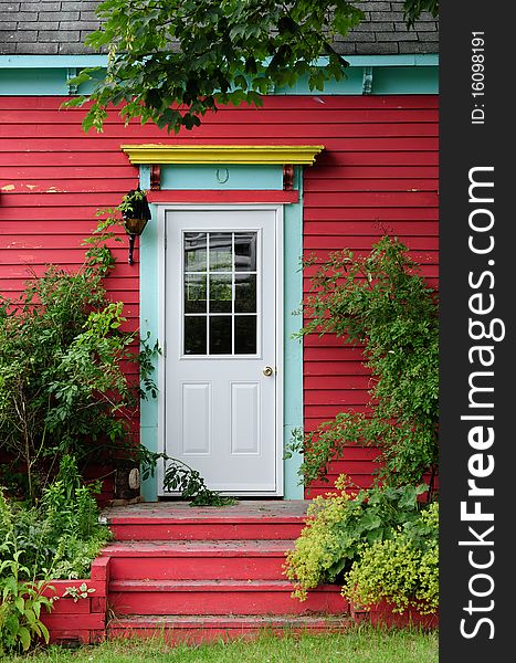 Door surrounded by foliage with vibrant colors. Door surrounded by foliage with vibrant colors