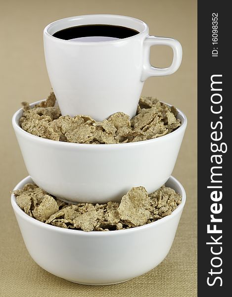 A cup of coffee and breakfast cereal