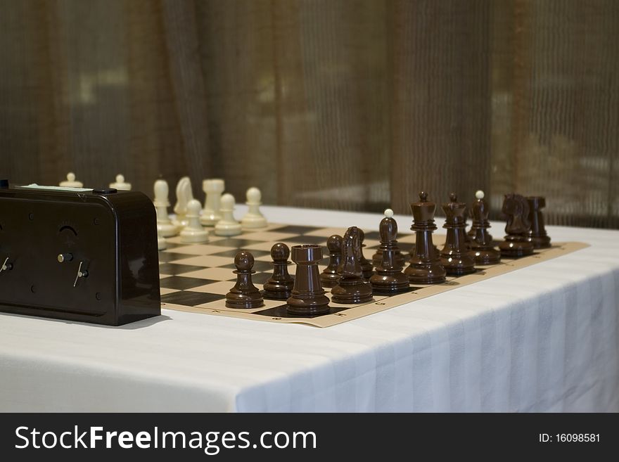 Chess board on a table ready for new game.