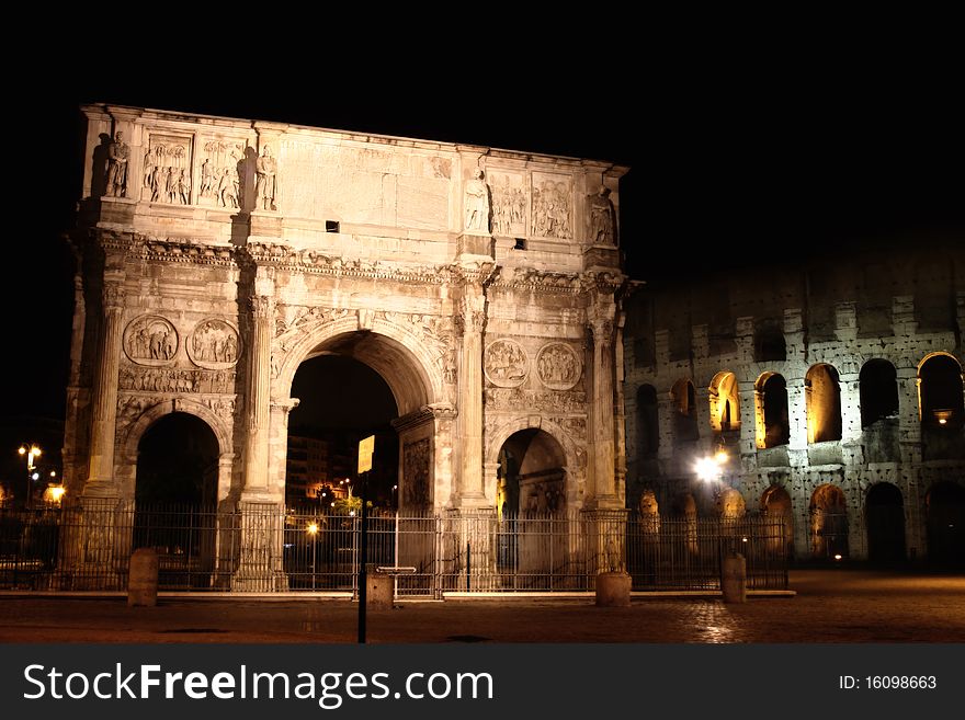 Details of night Arco de Constantino and Colosseum in Rome, Italy