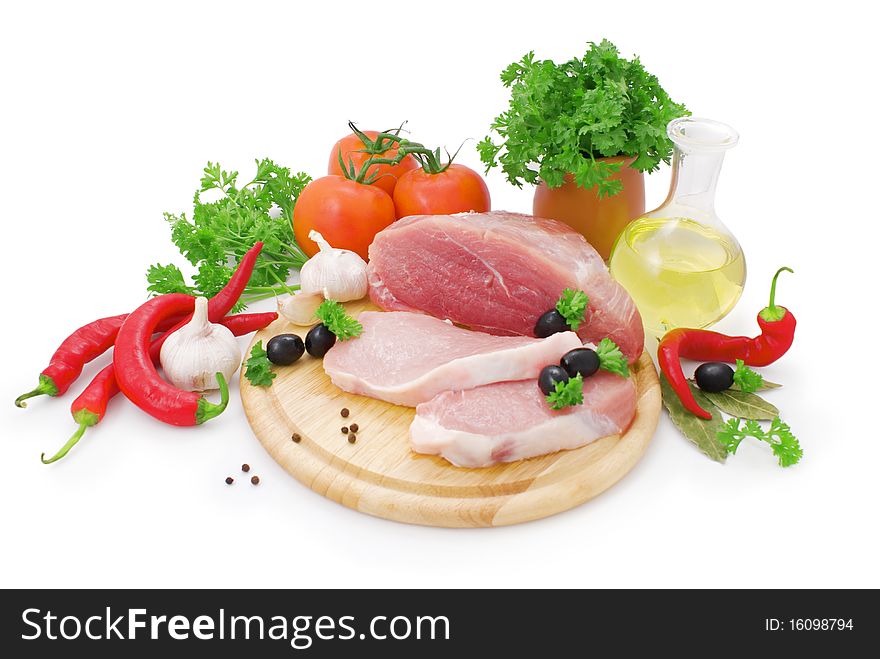 Nice fresh meat, greens, spices and vegetables iaolted on white background. Nice fresh meat, greens, spices and vegetables iaolted on white background