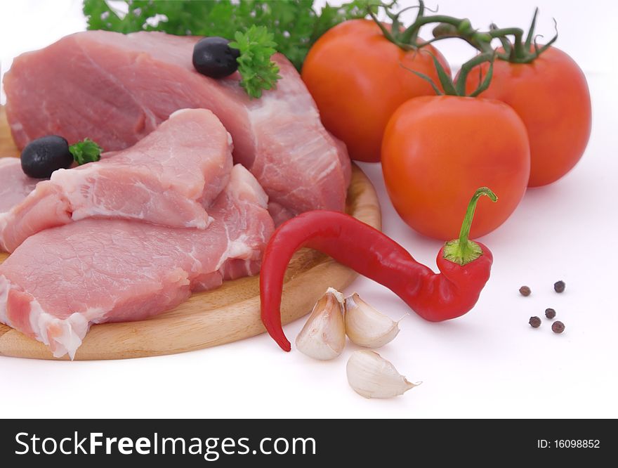 Nice fresh meat, vegetables herbs and spices on white background. Nice fresh meat, vegetables herbs and spices on white background