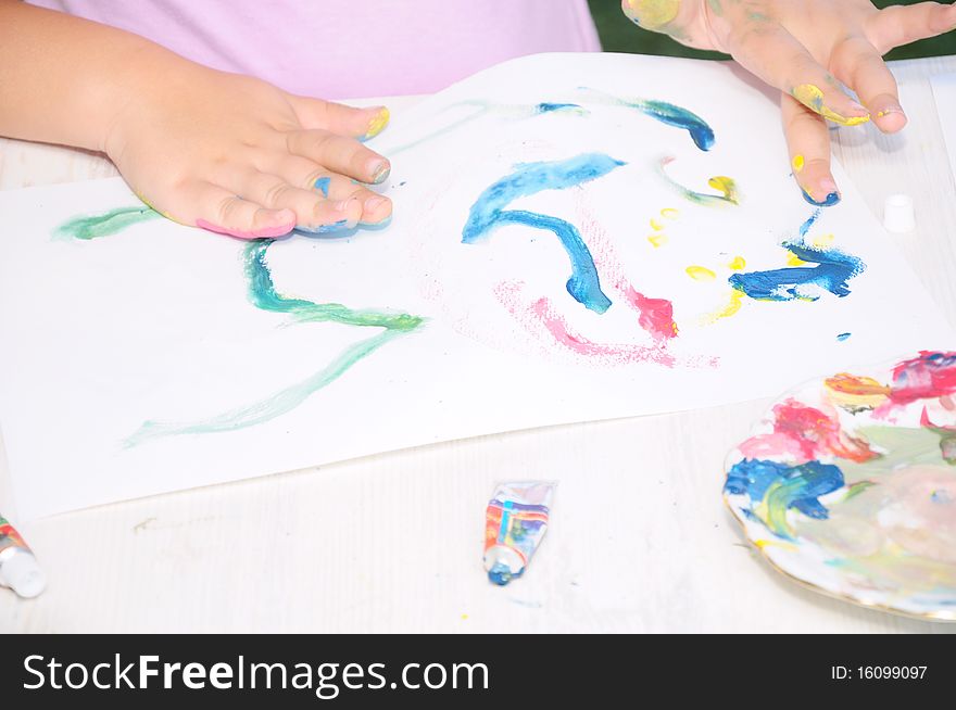 Child painting on paper with fingers. Child painting on paper with fingers