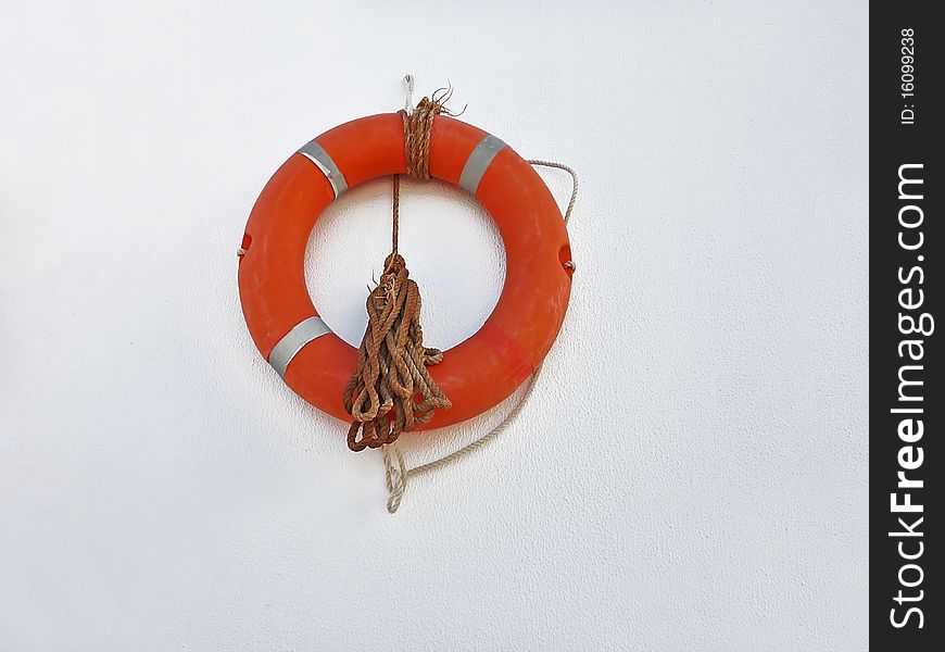 Orange lifebuoy with rope for saving life