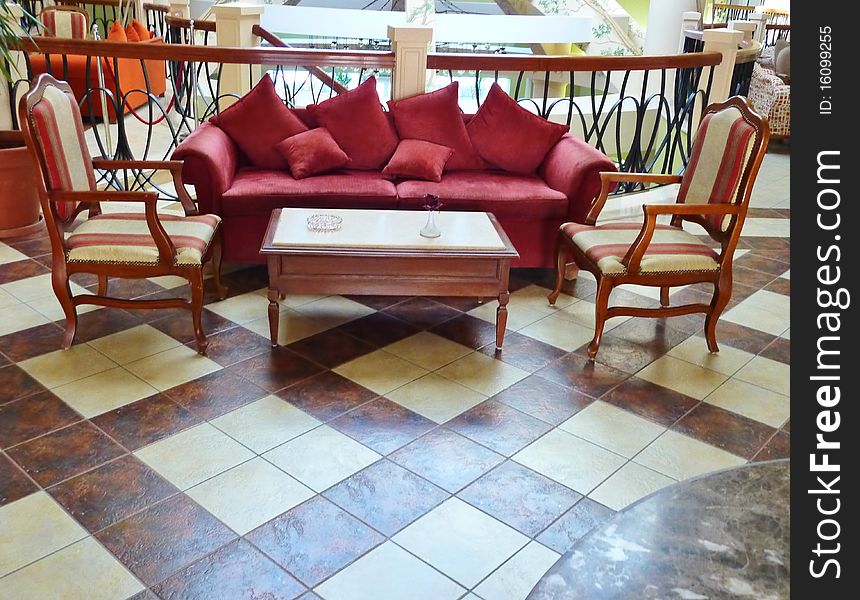 Sofa with chairs in a big hall of a hotel. Sofa with chairs in a big hall of a hotel