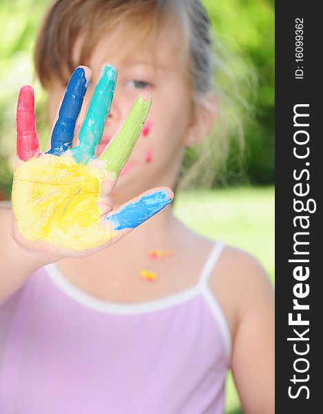 Girls colored face and hands in various colors. Girls colored face and hands in various colors