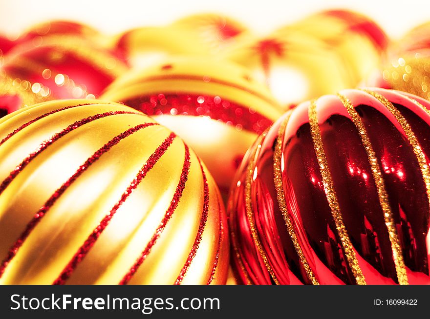 Red and gold christmas balls on a white background