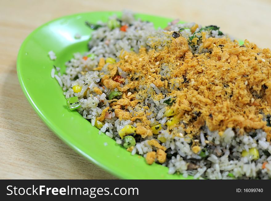 Asian vegetable olive fried rice with pork floss topping. Suitable for concepts such as diet and nutrition, healthy lifestyle, and food and beverage.