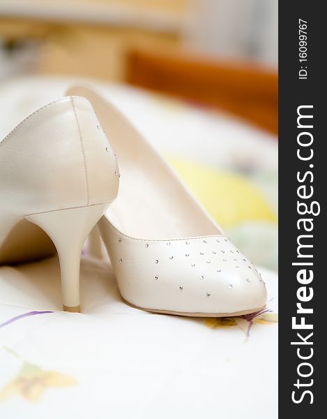 Pair of the white weddings by a shoe. Pair of the white weddings by a shoe