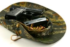 Handgun And Ammo In A Hat Royalty Free Stock Photography