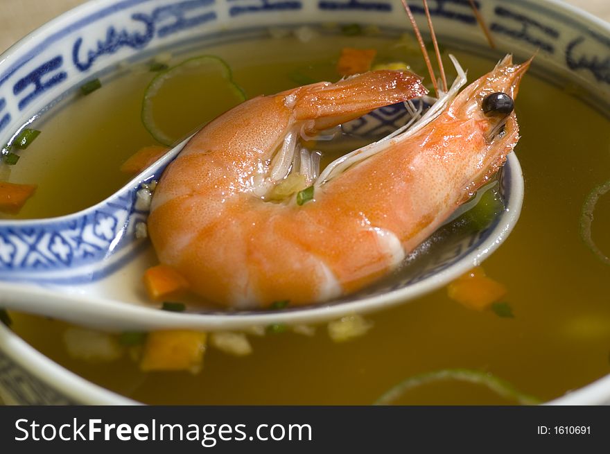 Cinese prawn soup in a bowl close up