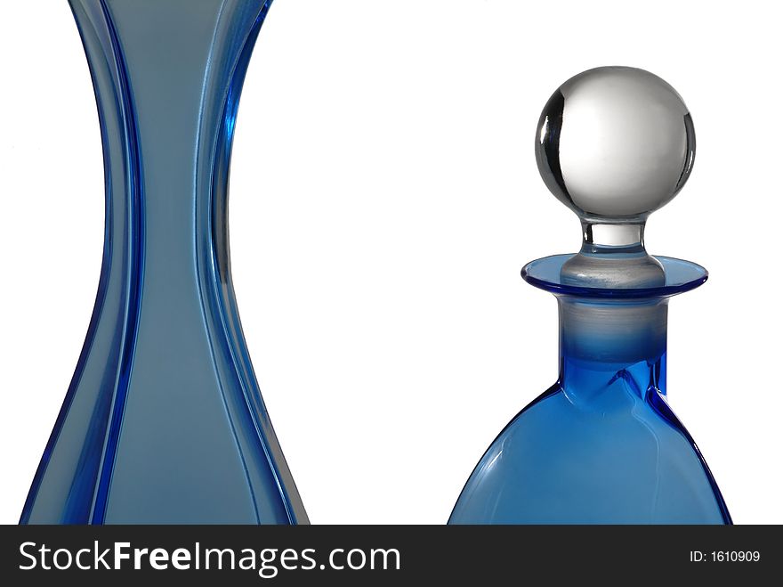 Beautiful blue bottles in glass on white
