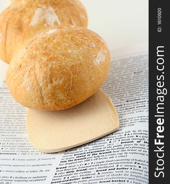 Concept of staple diet illustrated with bread placed on dictionary