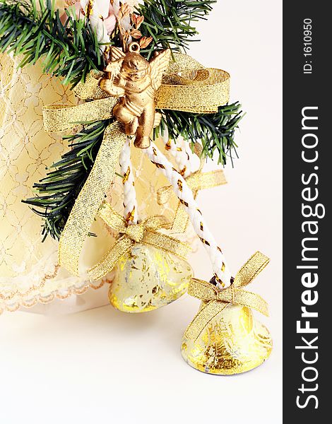 Christmas decoration - bells with green branch and bottom of the angel's dress