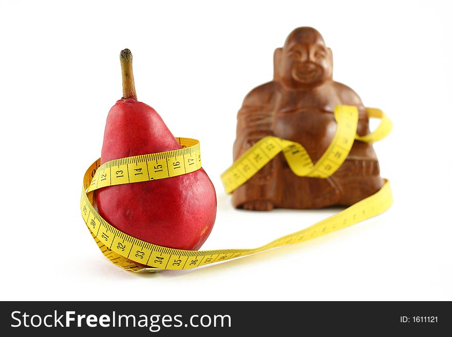 Red pear with fat budda and measuring tape, isolated on white