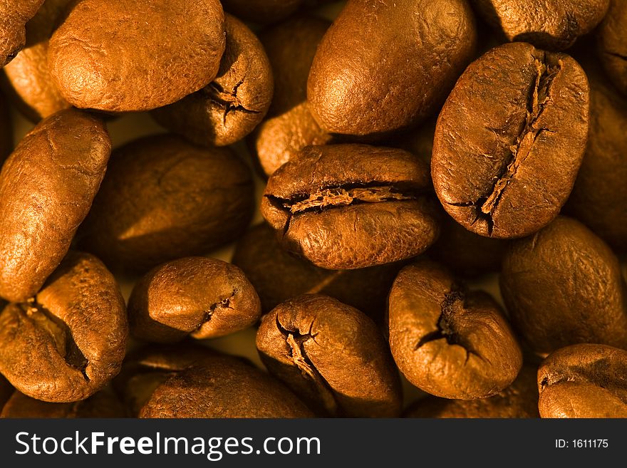 Macro of some golden brown coffee beans