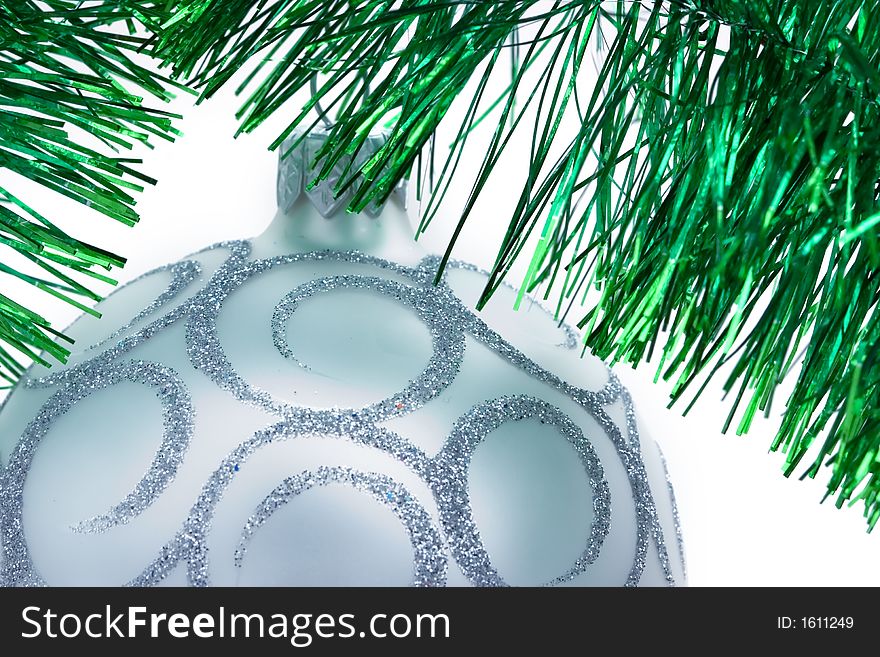 Christmas decoration on the silver tinsel background