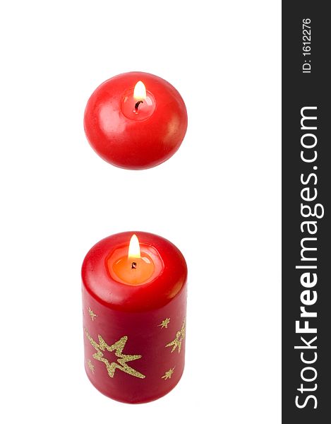 Two diferent candles on white background close up