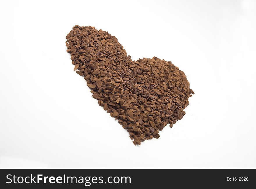 A heart made of coffee against white background. A heart made of coffee against white background