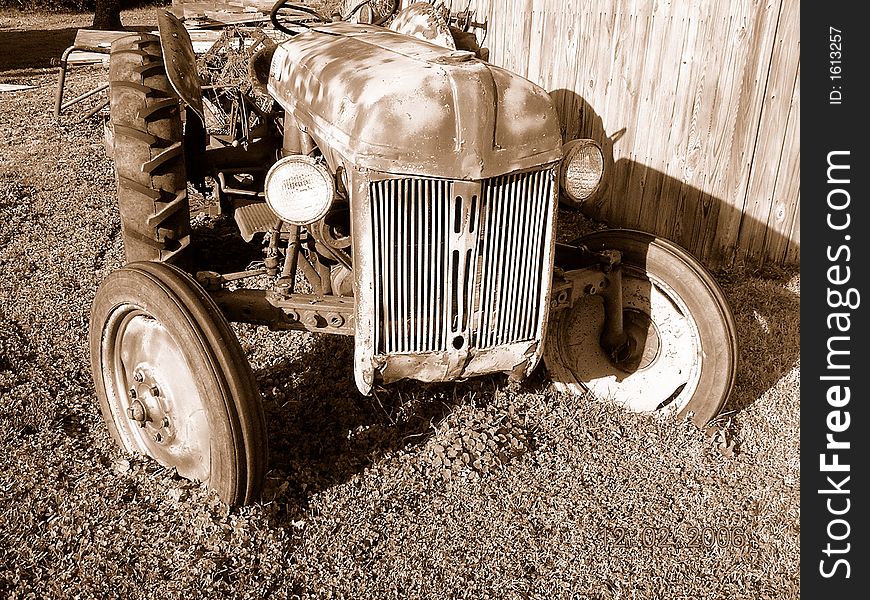 A once new tractor but now left to rust. A once new tractor but now left to rust.