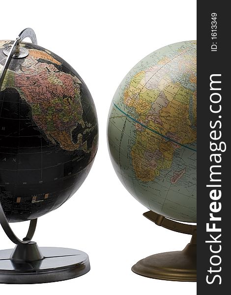 Terrestrial globe in black color showing the american continent facing a blue globe showing the african continent. Terrestrial globe in black color showing the american continent facing a blue globe showing the african continent