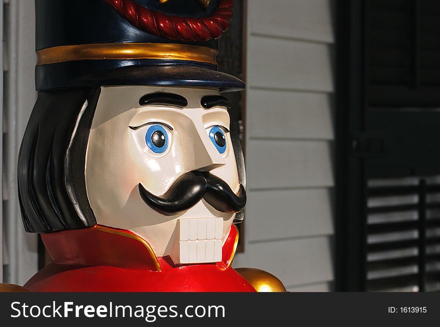 Closeup of vintage (Victorian) wooden toy soldier (5 feet tall) Christmas porch decoration. Closeup of vintage (Victorian) wooden toy soldier (5 feet tall) Christmas porch decoration