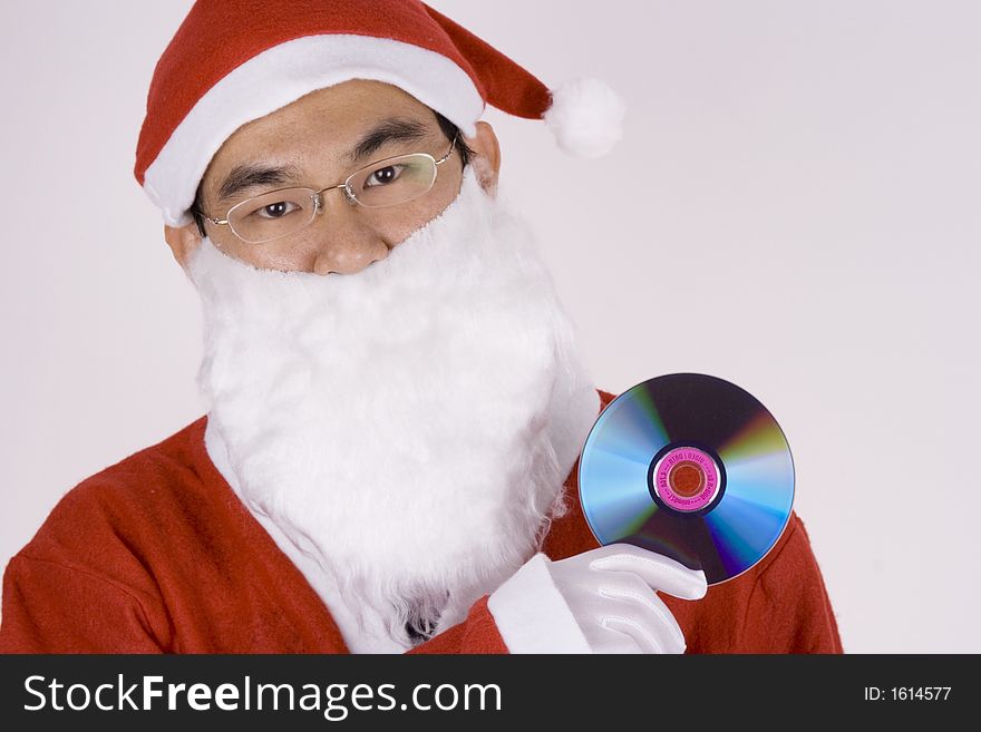 Asian Santa Claus holding a compact disc. Asian Santa Claus holding a compact disc.