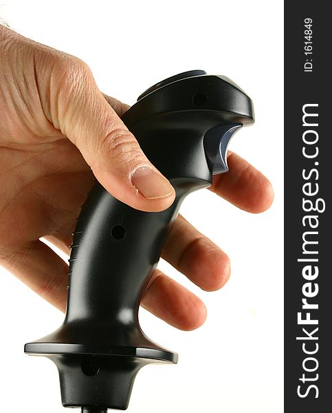 A joystick isolated on white space with a man's hand reaching for it