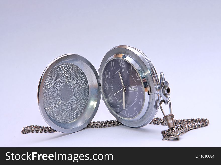 Pocket watch on white surface
