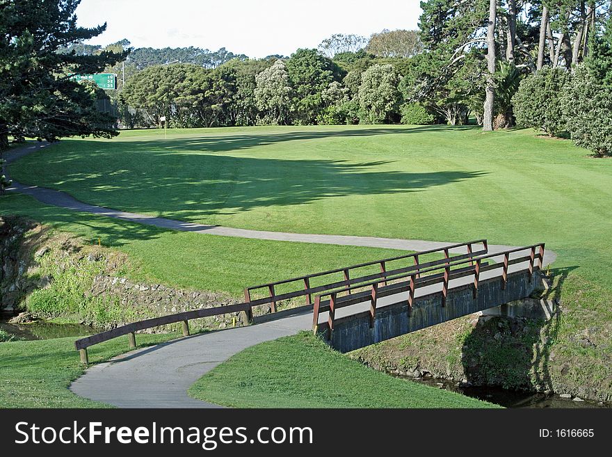 Concrete bridge before a hole on a golf course