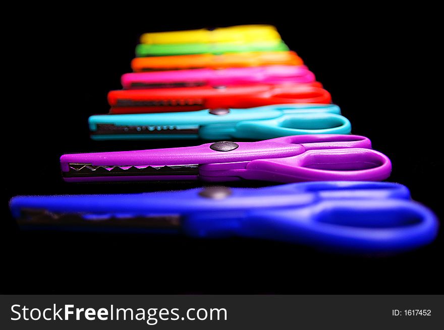 A set of eight colorful pairs of scissors. A set of eight colorful pairs of scissors