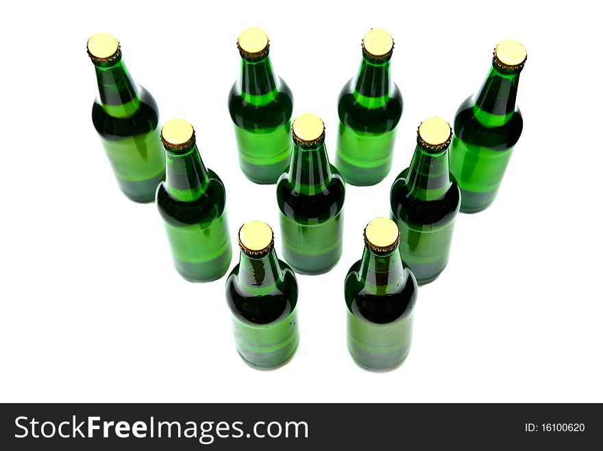 Rows from beer bottles on white background. Rows from beer bottles on white background.