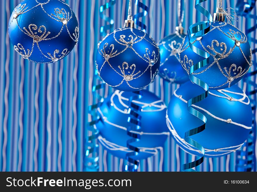 Christmas decoration from blue balls on blue background. Christmas decoration from blue balls on blue background