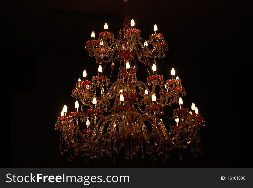 Beautiful chandelier with candles shining. Beautiful chandelier with candles shining