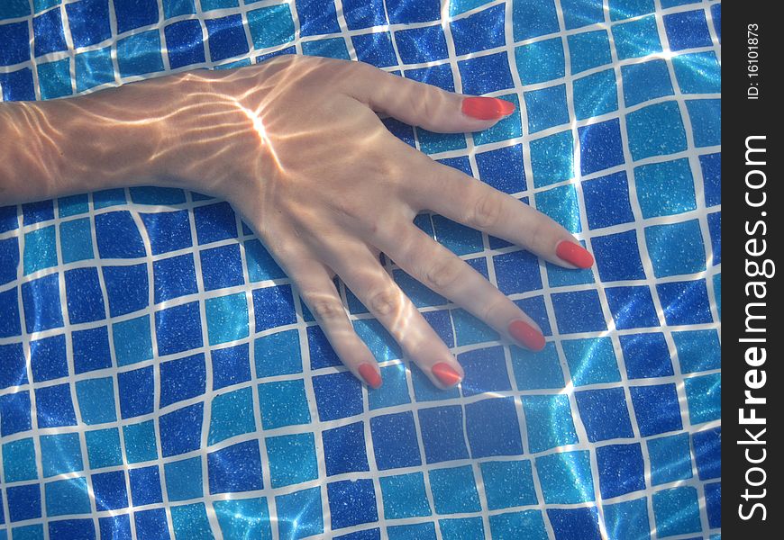 Hand in pool under water. Hand in pool under water