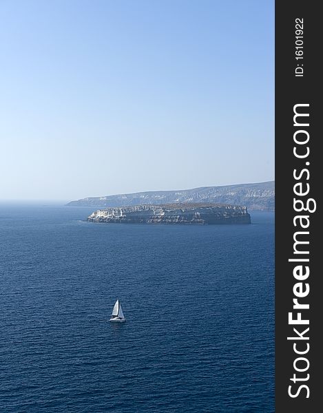 A white sailboat in the aegean. A white sailboat in the aegean